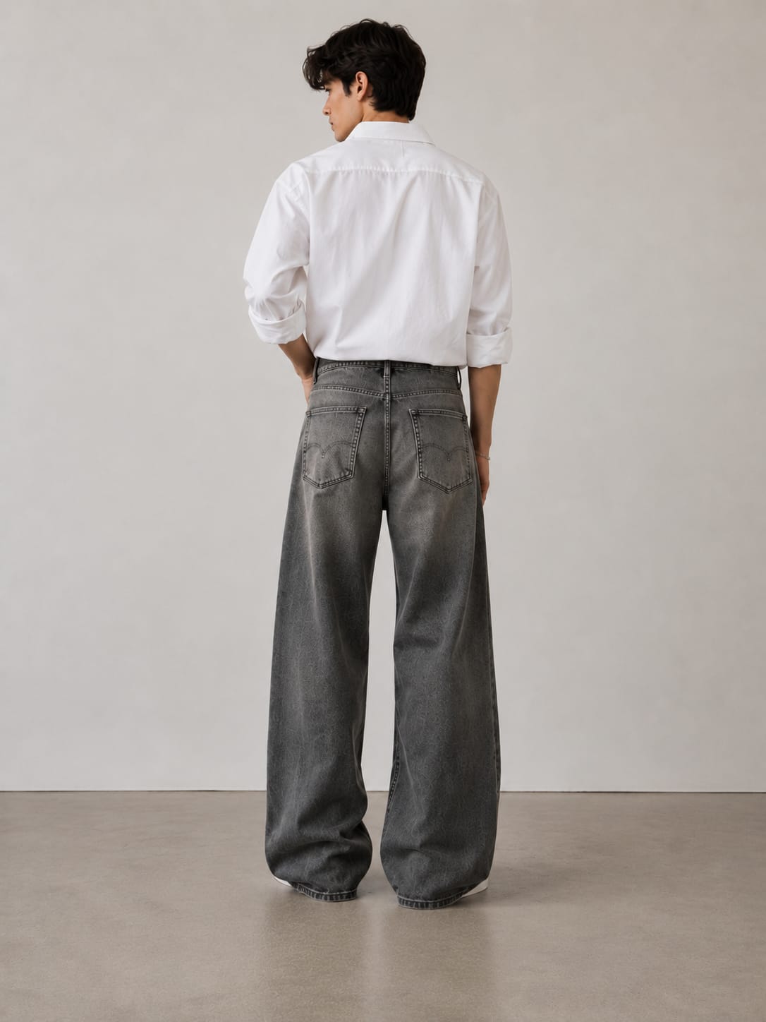 Look 02 — charcoal monogram wide-leg jeans, reverse